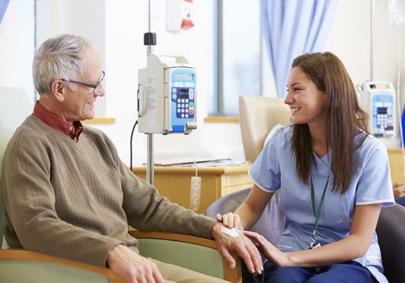 Senior Man Undergoing Chemotherapy With Nurse Senior Man Undergoing Chemotherapy With Nurse